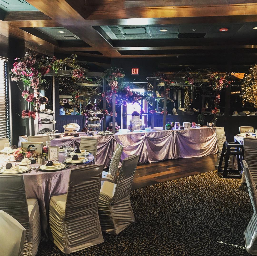 Banquet room with lush floral centerpieces