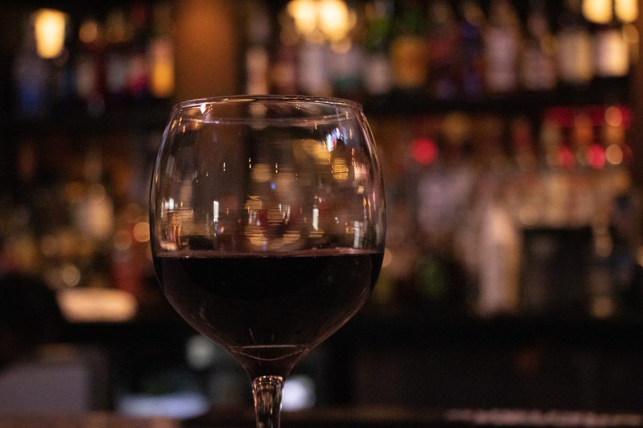A glass of red house wine at the Da Francesco's bar